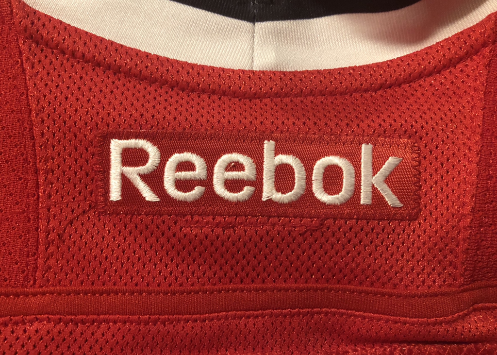 11-12 Reebok Wordmark - CHICAGO BLACKHAWKS JERSEY HISTORY